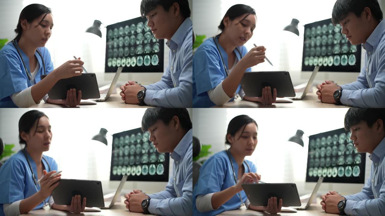 医生在数字平板电脑上与患者交谈