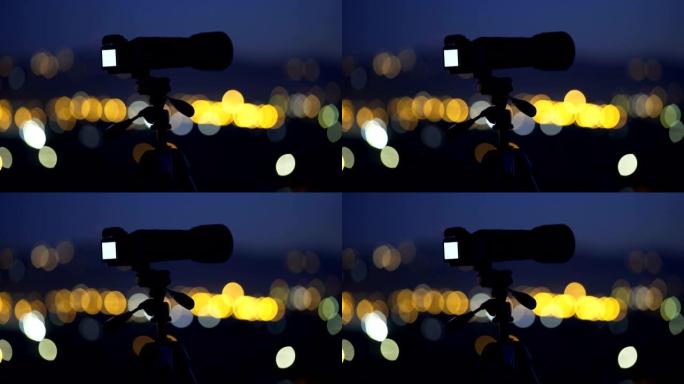 摄像机站在夜城之光的背景上。广角。实时