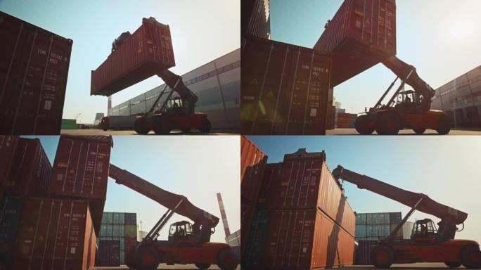 现代集装箱搬运工在造船厂码头运送大型红色钢制货物储存集装箱。操作搬运设备的驾驶员正在物流中心装载板条