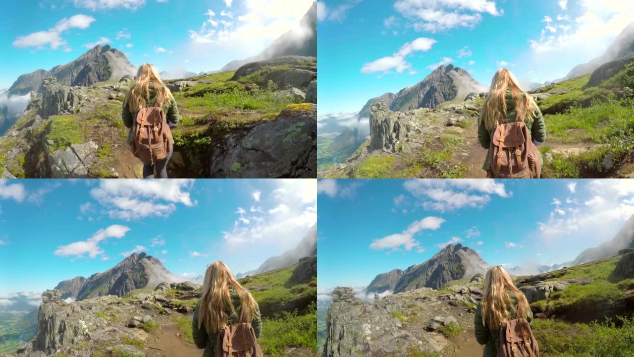 一个无法识别的女人在挪威山上徒步旅行的4k视频片段