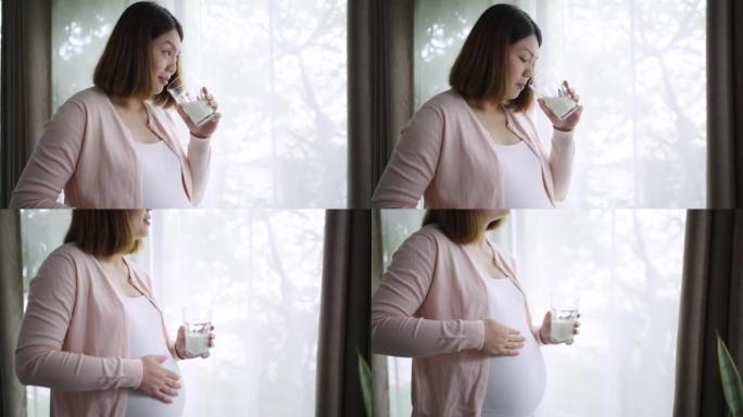 孕妇在家放松并为婴儿喝牛奶