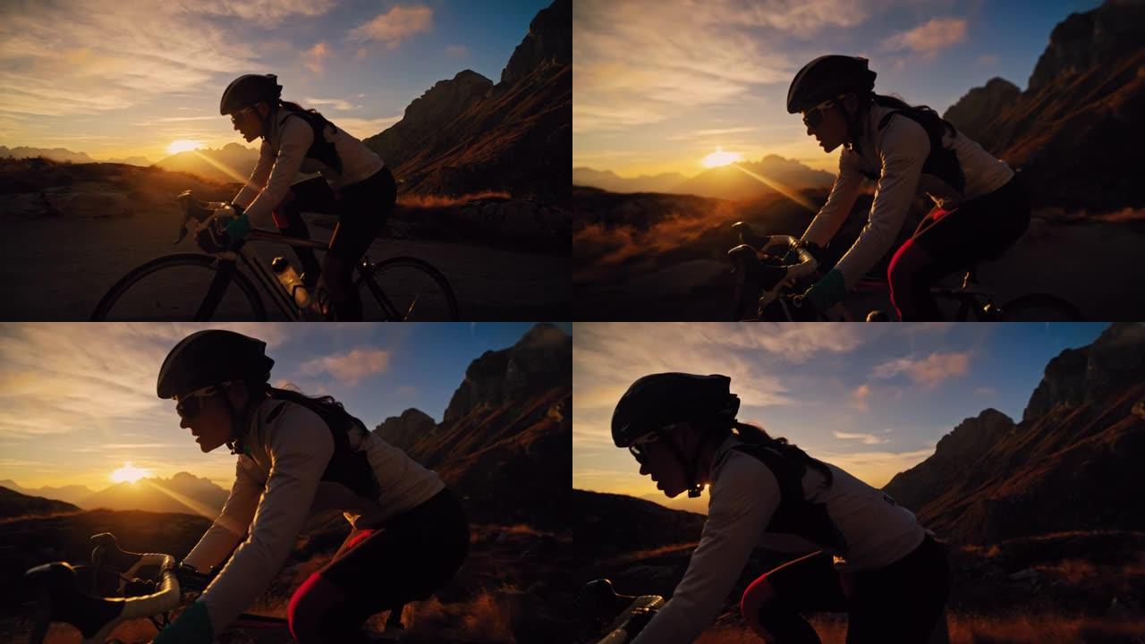 骑自行车的人在阳光明媚的田园诗般的日出山上骑自行车