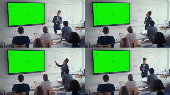 黑人女老师向学生讲解课程，使用绿屏数字白板。成功的女人谈论设计。科教理念