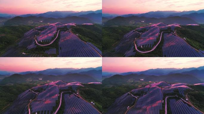 带日落的山顶太阳能发电厂的鸟瞰图