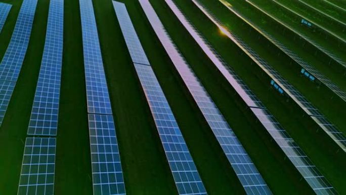 无人驾驶飞机在农村太阳能农场的太阳能电池板上的太阳能阳光