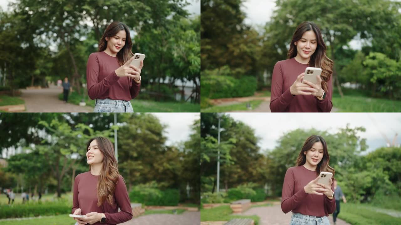 快乐的亚洲女人使用智能手机