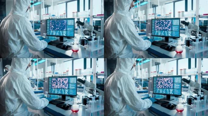 医学实验室: 微生物科学家穿着无菌工作服，面罩和口罩，致力于计算机开发疫苗，药物和抗生素。屏幕显示了