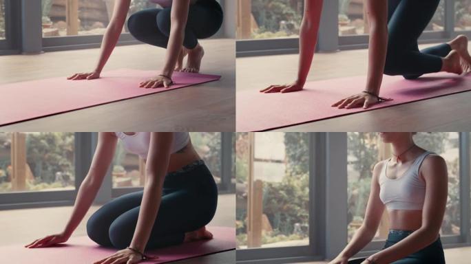 4k视频片段，一名年轻女子在准备瑜伽程序时推出运动垫