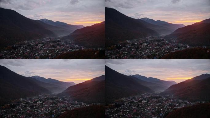 日落时山里的小镇。鸟瞰图