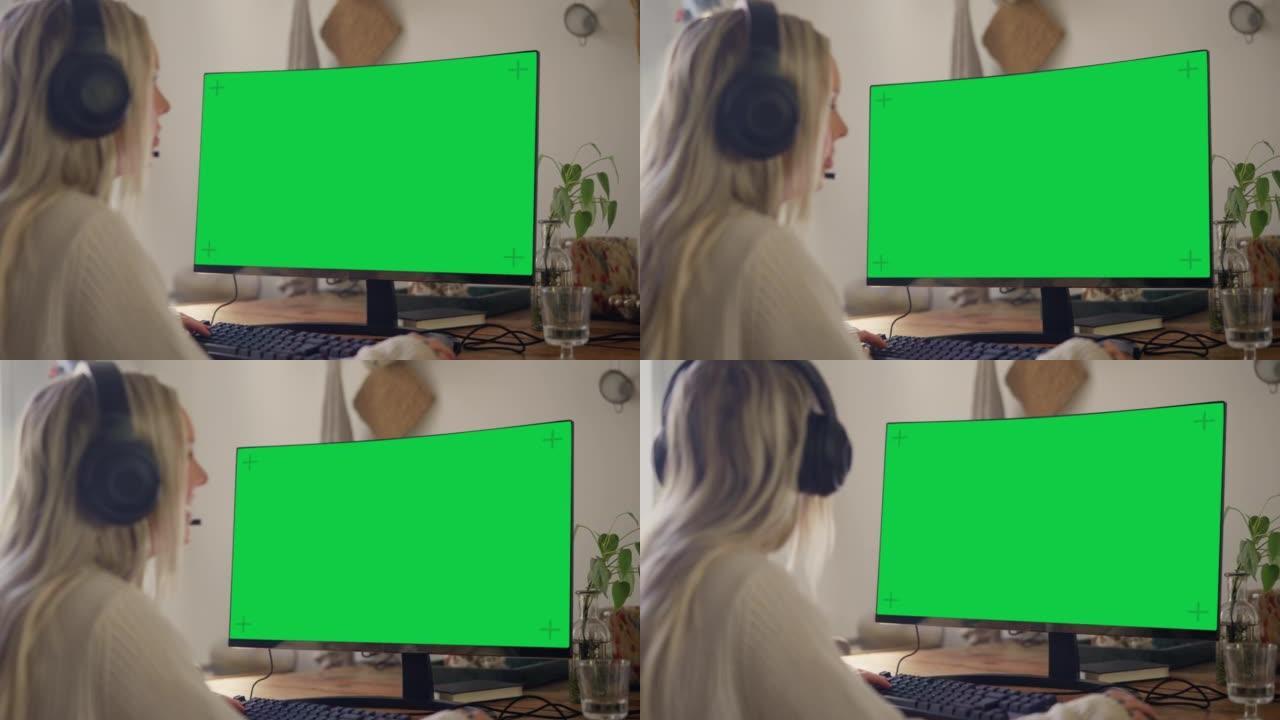 带色度键的电脑显示器-玩电脑游戏的女人