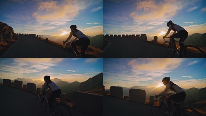 在风景秀丽的日出山区，骑自行车的女骑车人