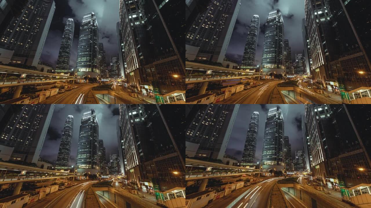 香港夜间现代建筑下的道路和隧道交通灯的时间流逝