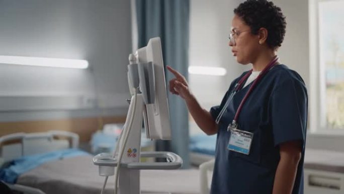 医院病房: 漂亮的黑人女护士长，医生，外科医生使用保健生命体征监测计算机机。拥有先进设备和专业人员的