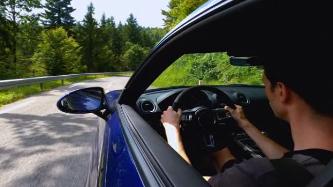 驾驶员体验沿着风景秀丽的乡村道路行驶的快感