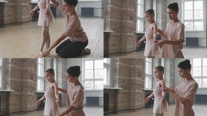 小女孩和教练一起学习芭蕾舞
