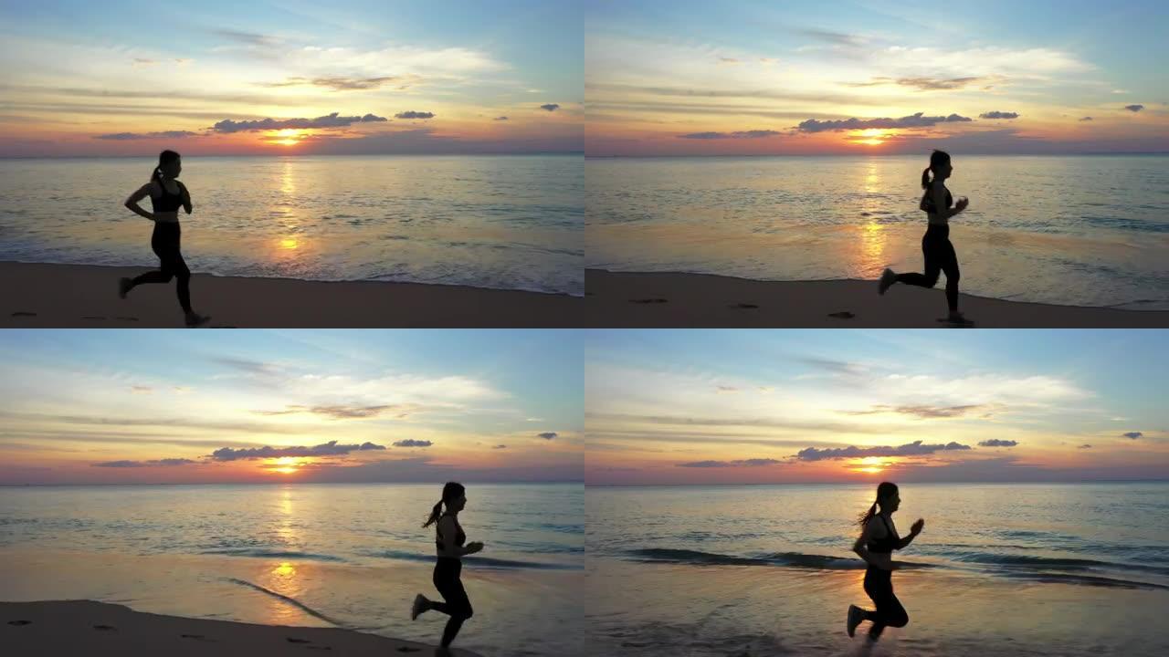 日落时沿着海滩的空中跑步者