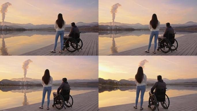 残疾丈夫站在轮椅上的女人站在码头上