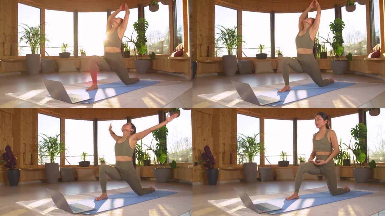 慢动作: 在线瑜伽锻炼后，亚洲女性在低前弓步姿势
