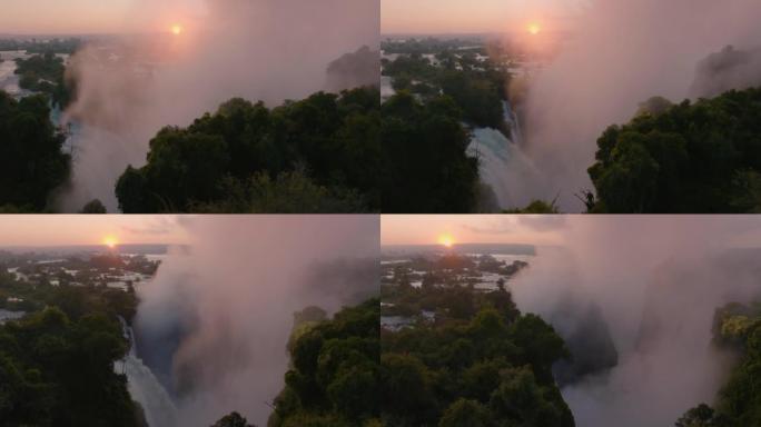 空中日出摇摄在联合国教科文组织世界遗产维多利亚瀑布边缘流动的薄雾和水