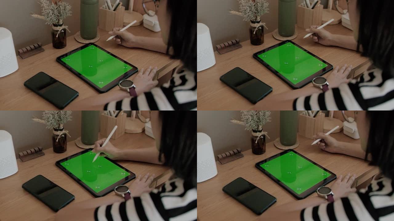 女性使用绿屏。平板电脑ipad绿幕绿屏抠