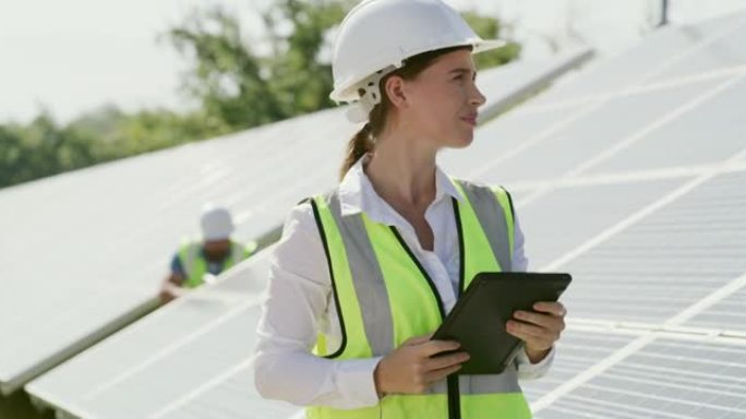 一名女工在太阳能电池板上进行检查的4k录像