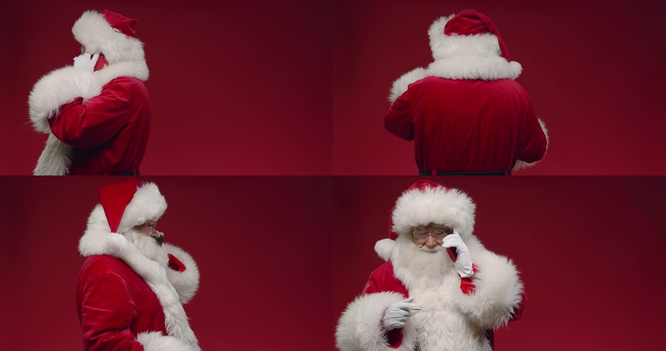 一个转身的圣诞老人在红色背景下在电话上交谈，右边是复制空间