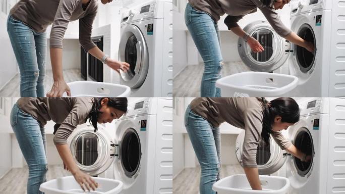 亚洲妇女在洗衣机上装脏衣服