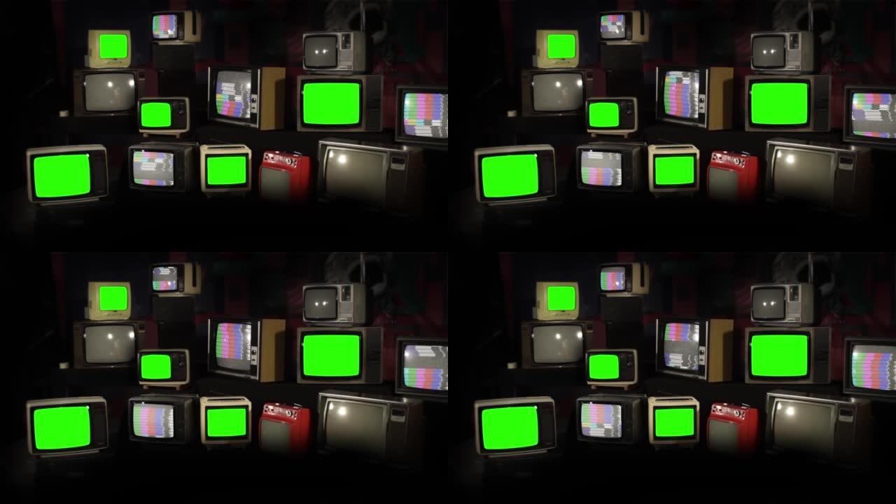 旧电视机，堆叠的复古老式电视，有些带有绿色屏幕和彩条。