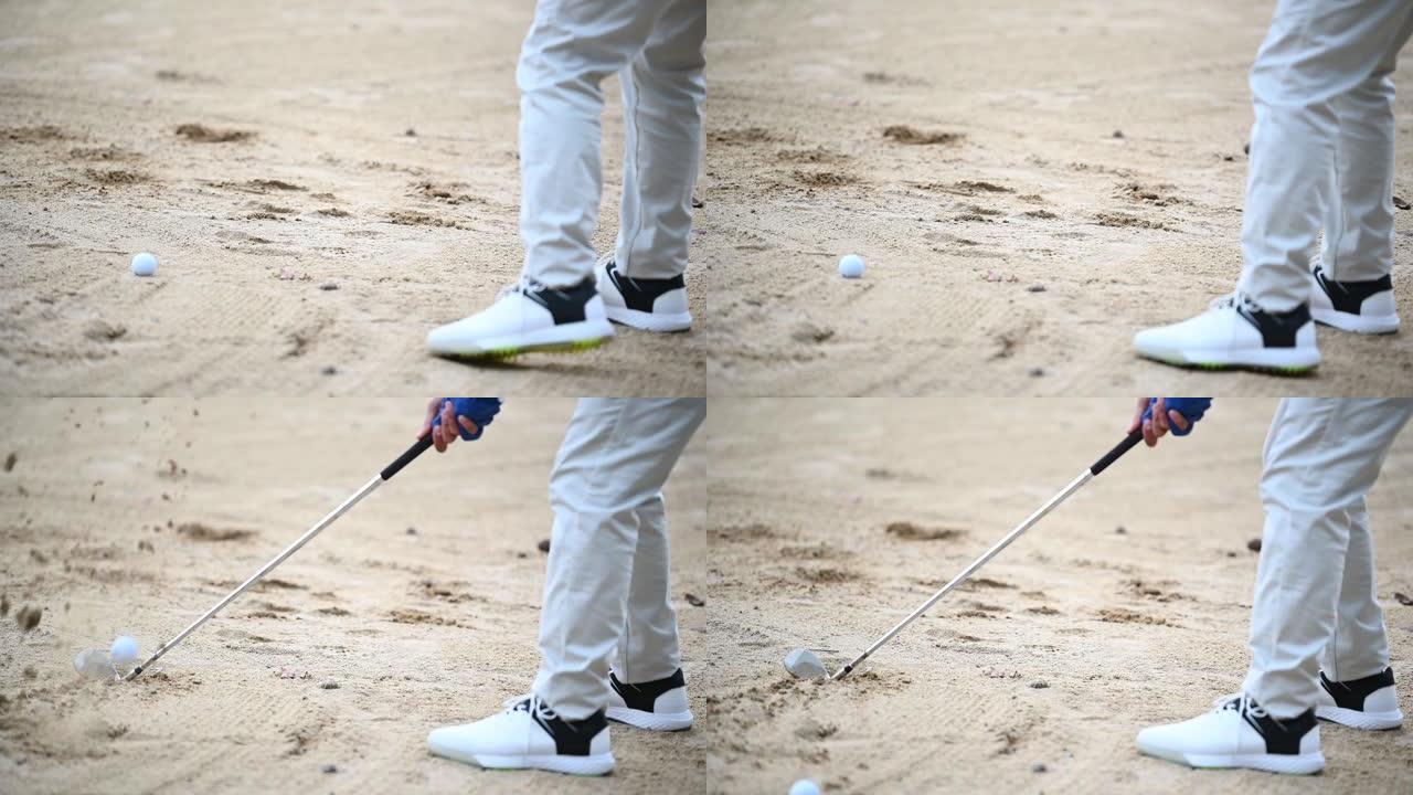 一名亚洲中国高级男子高尔夫球手用铁棍在沙坑中击中高尔夫球