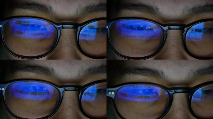 亚洲女人看着电脑镜片反射观看电脑眼镜玻璃