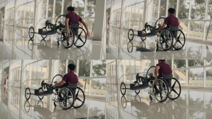 亚洲瘫痪男子推着自行车。