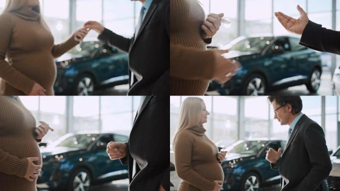 SLO MO汽车推销员交出钥匙并与孕妇握手