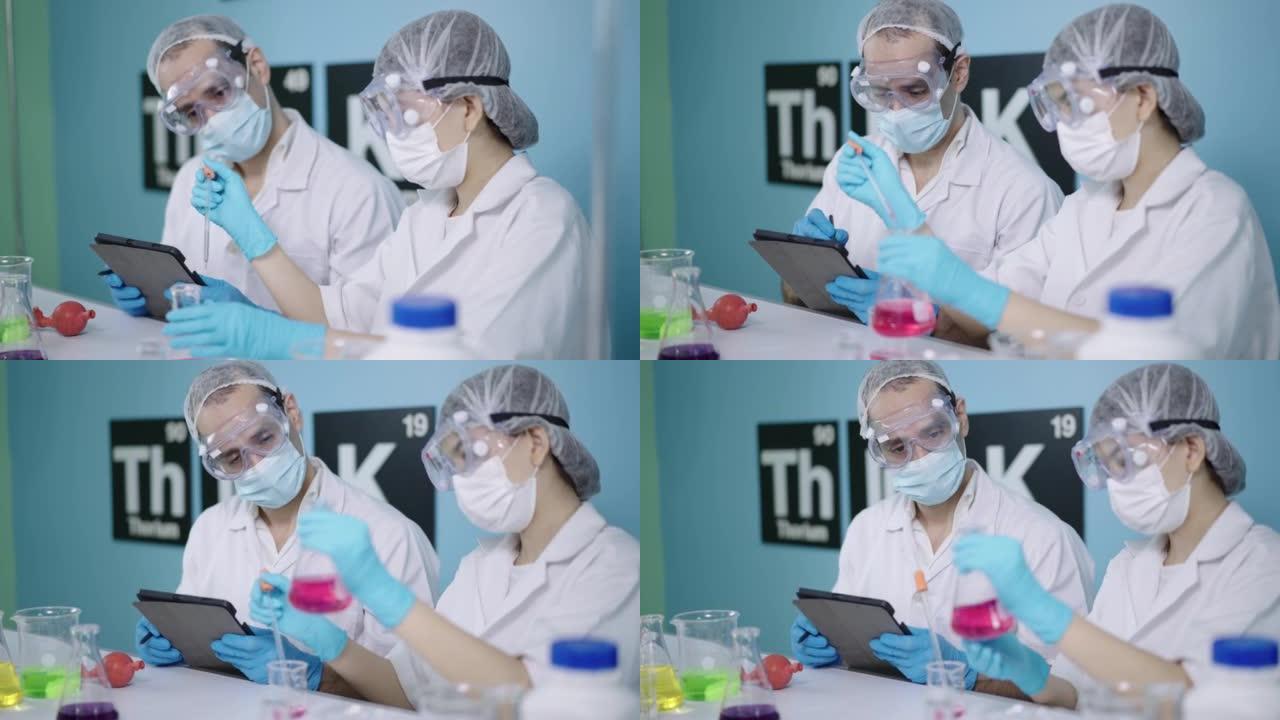 老师与年轻科学家女孩一起在实验室学习化学知识