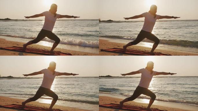 女人在户外日落时在大自然中摆树瑜伽姿势。张开双臂的运动瑜伽女子在海水海滩练习瑜伽