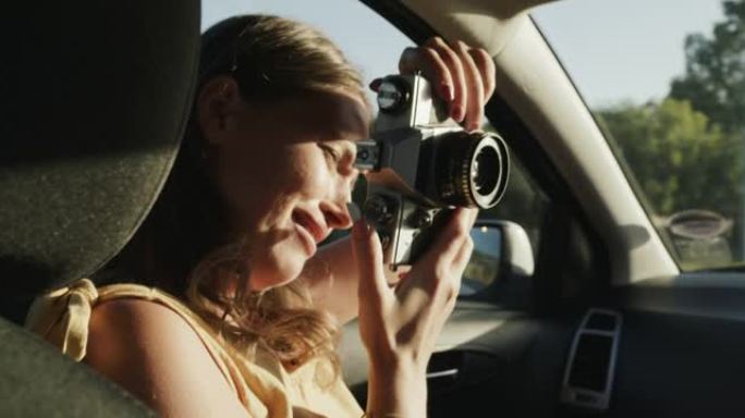 一名年轻女子在车上拍摄男友照片的4k视频片段