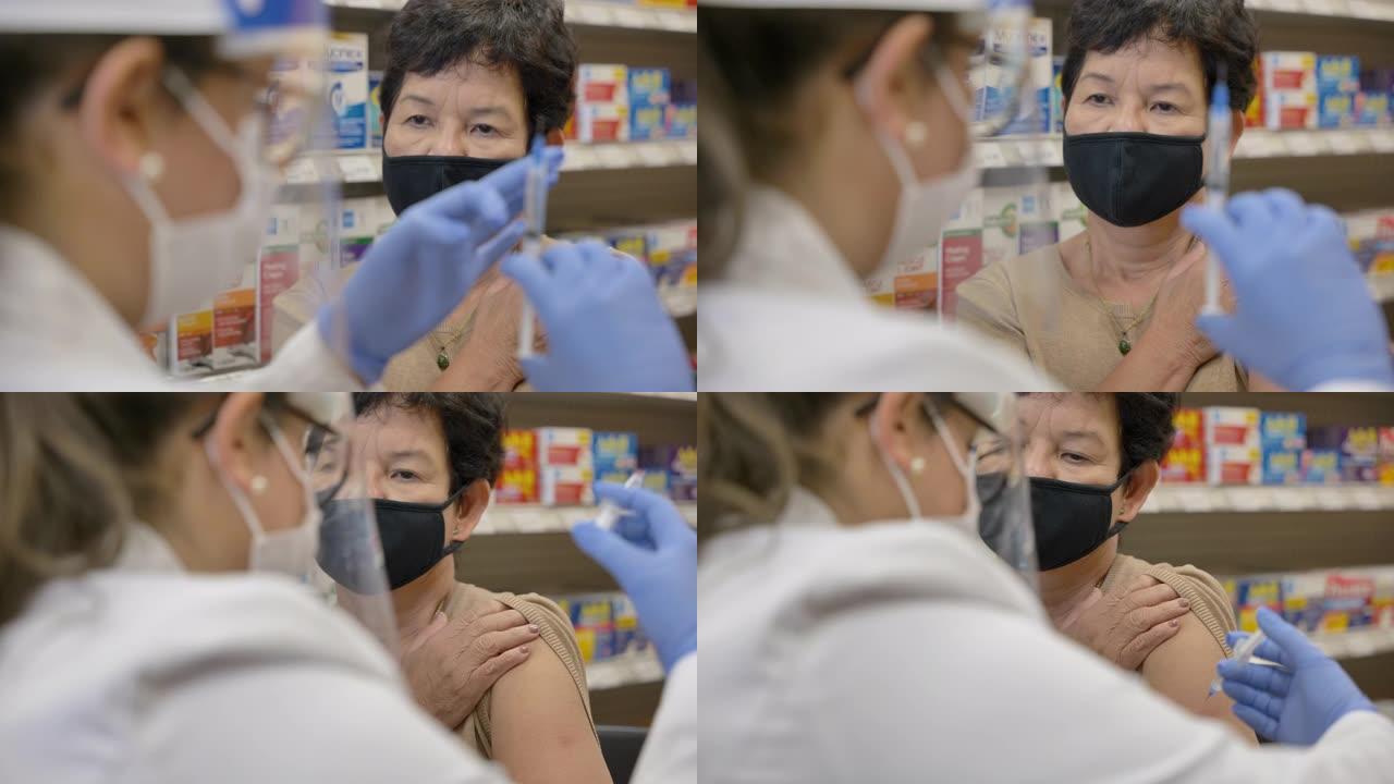 药剂师戴口罩时接种疫苗
