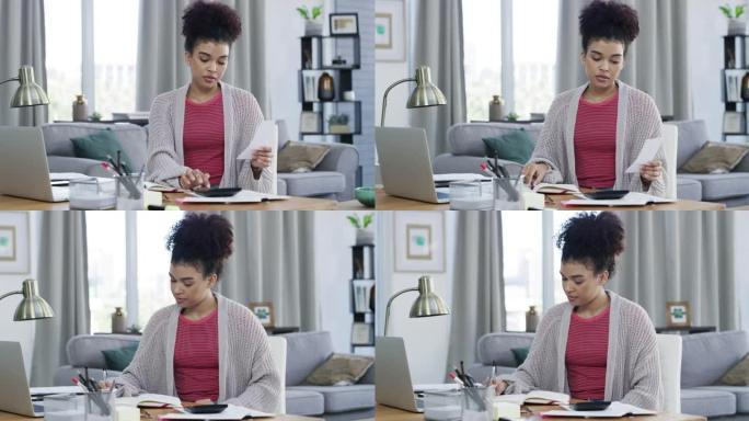 4k视频片段，一名妇女坐在家里做计算和做笔记