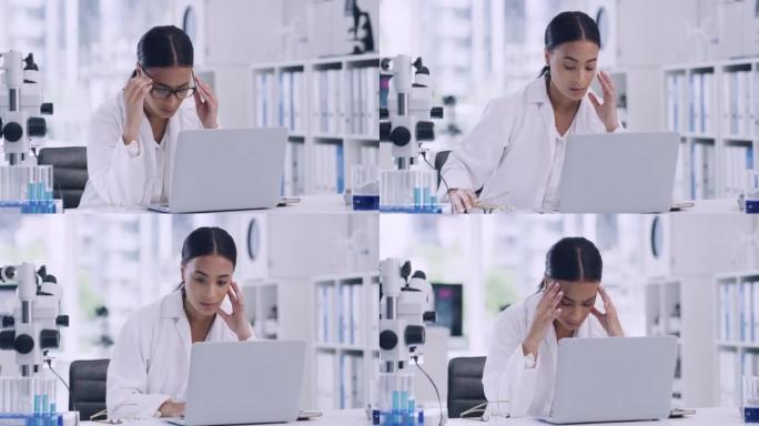 由于工作量和实验室的截止日期而导致头痛或偏头痛疼痛的化学家。压力大的科学家在实验室里使用笔记本电脑，