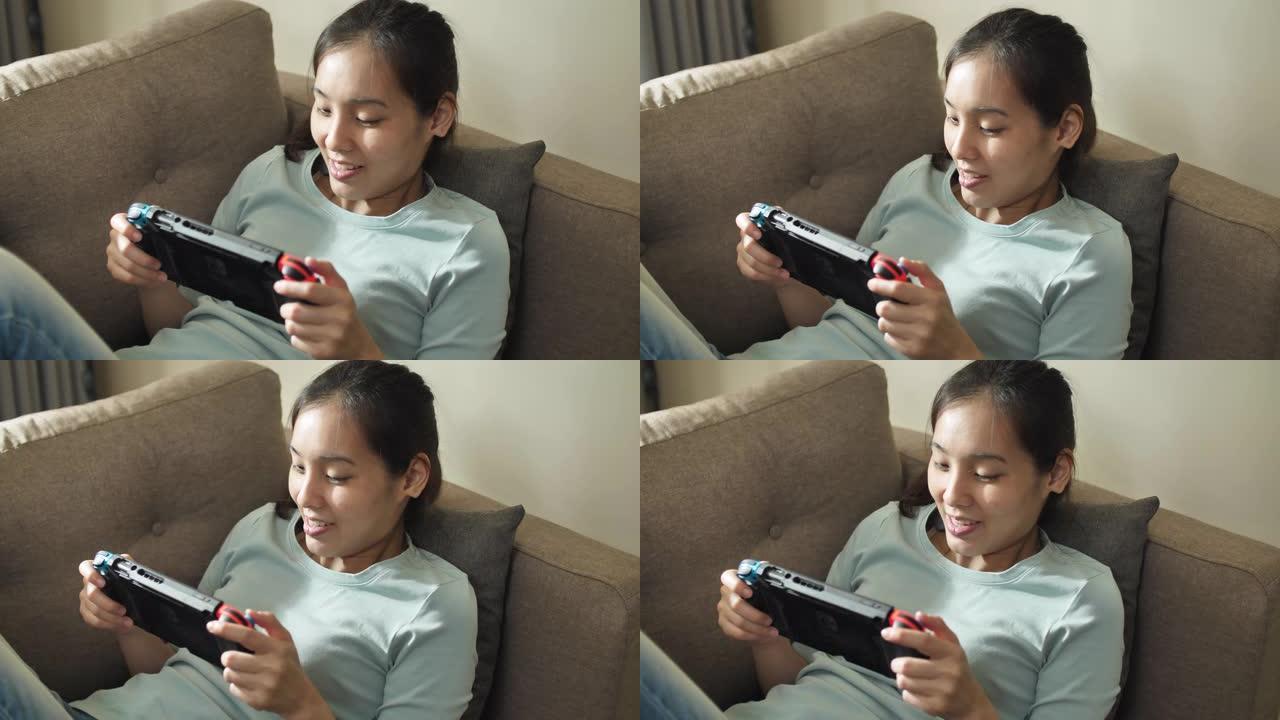 年轻兴奋的女人在家玩游戏