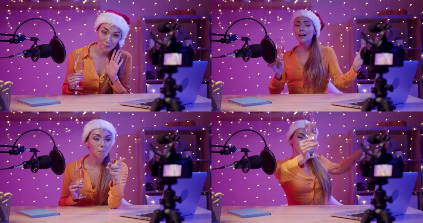 一个戴着圣诞老人帽子的博主女孩为她的订阅者录制了圣诞节视频问候