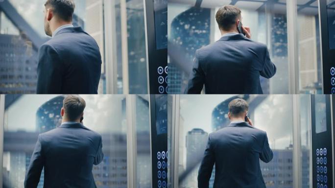 成功的商人穿着西装骑着玻璃电梯到现代商务中心的办公室。英俊严肃的男人在打电话，在电梯里接一个重要的商