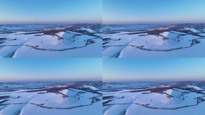 航拍内蒙古额尔古纳雪域山峦暮色