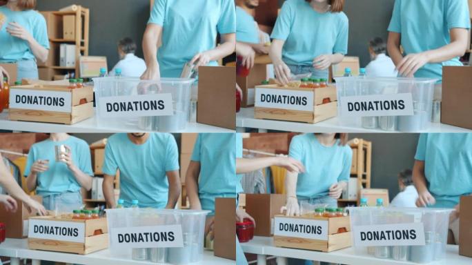 在慈善基金工作的捐款箱中包装食物的活动家团队