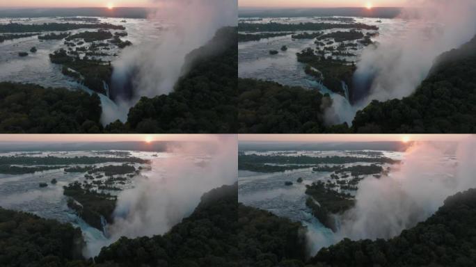 空中日出摇摄在联合国教科文组织世界遗产维多利亚瀑布边缘流动的薄雾和水