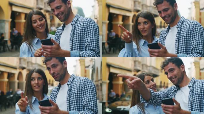 年轻快乐浪漫的游客夫妇使用智能手机上的应用程序，在假日旅行期间在老城中心观光时，一起检查新的游览地点