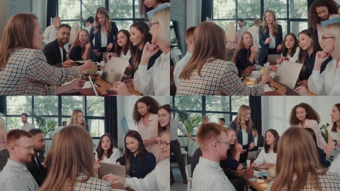 多民族业务团队的同事在与女老板慢动作的办公室会议上集思广益，分析销售数据。