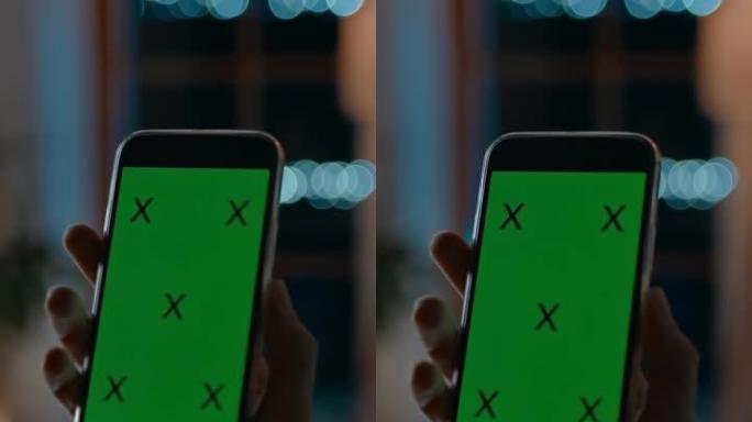 DS女人在带有色度键绿屏的智能手机上进行视频通话