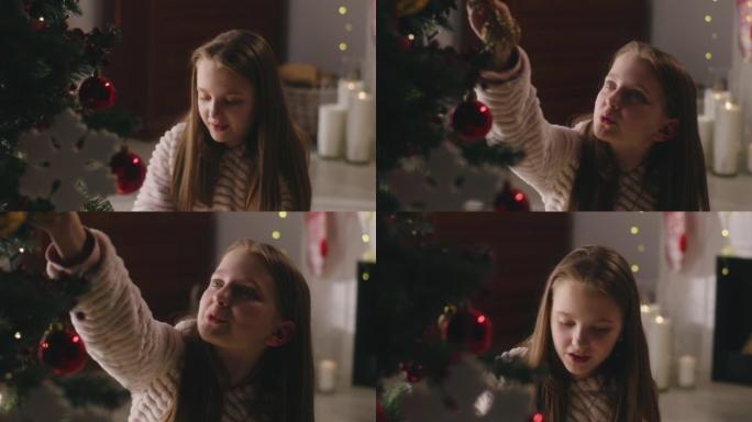年轻女孩装饰圣诞树