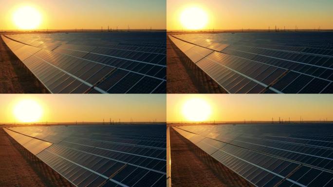 日落时太阳能发电厂的无人机镜头