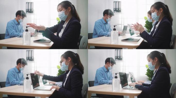 亚洲女商人戴着防护口罩，在办公室新型冠状病毒肺炎期间使用洗手液
